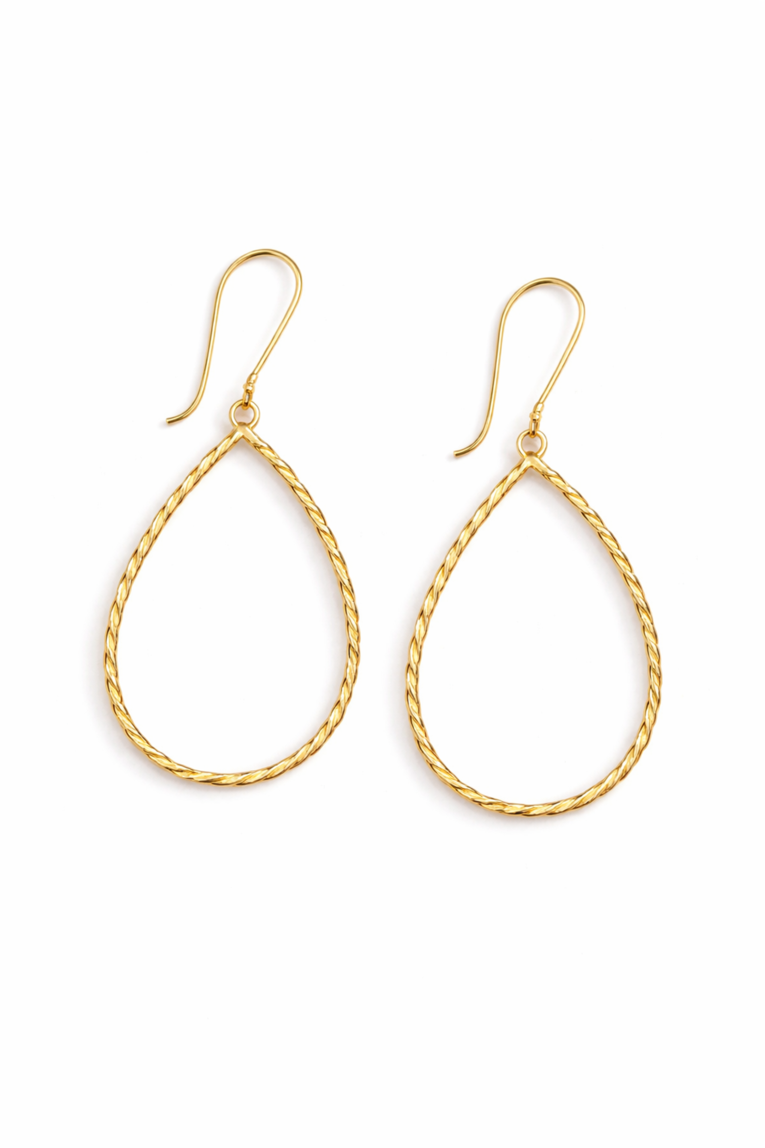 Gold teardrop earrings on a white background