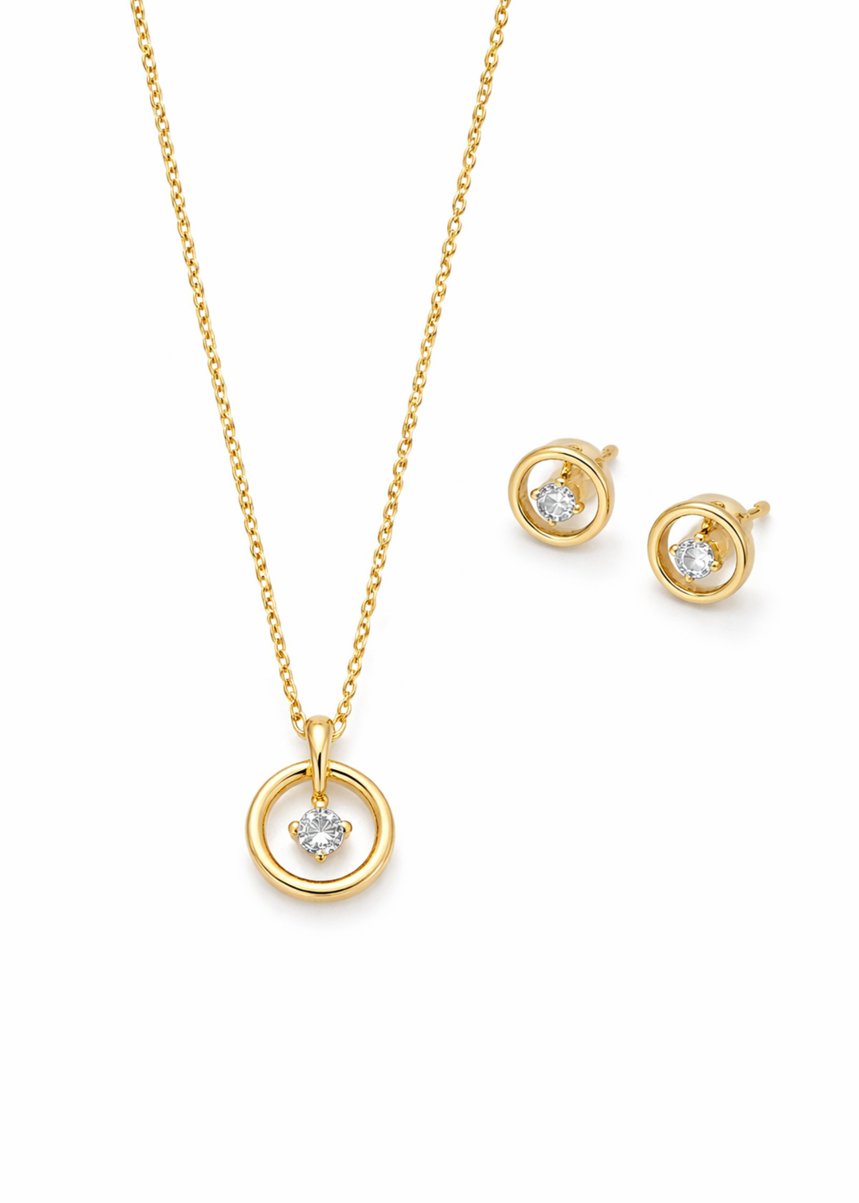 Gold necklace and earrings set on a white background