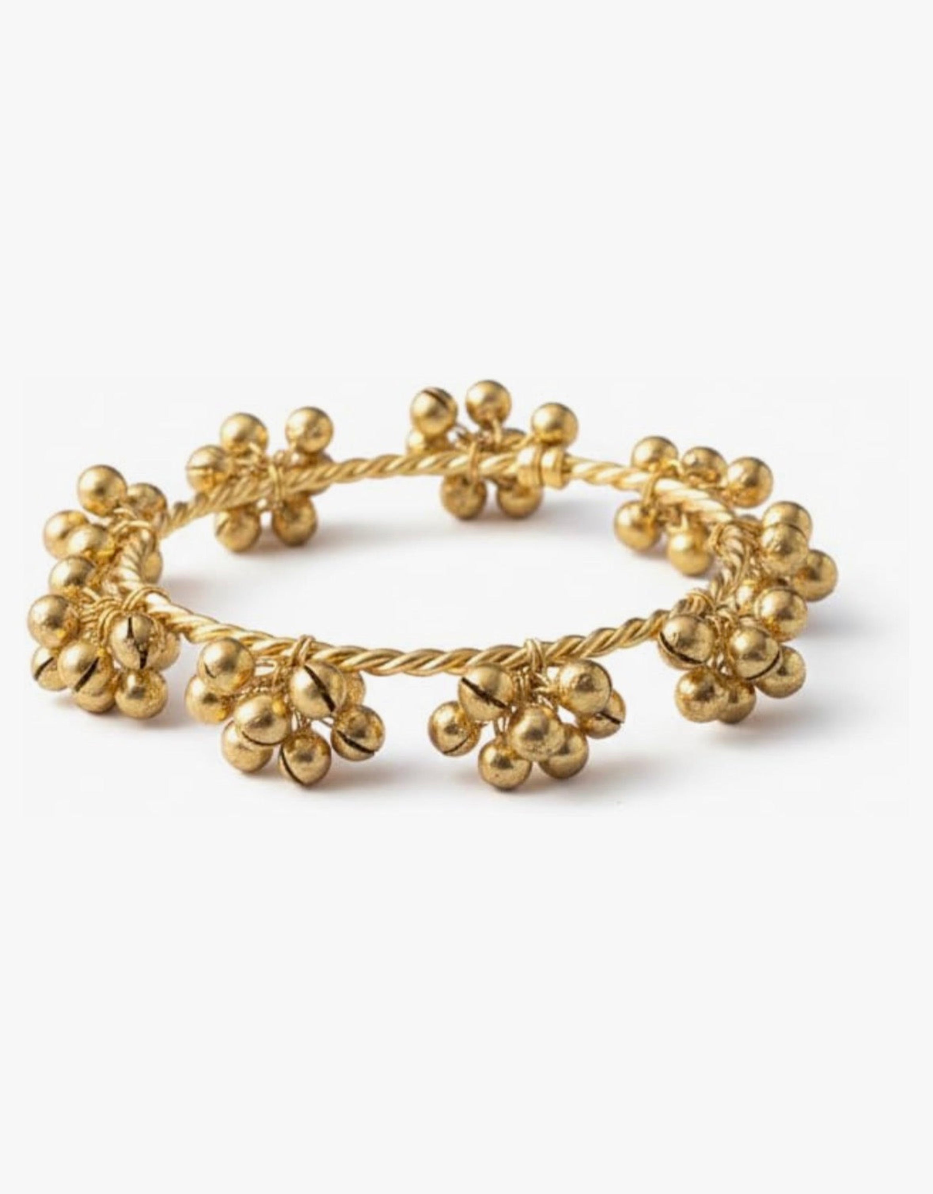 Gold bracelet with floral designs on a white background