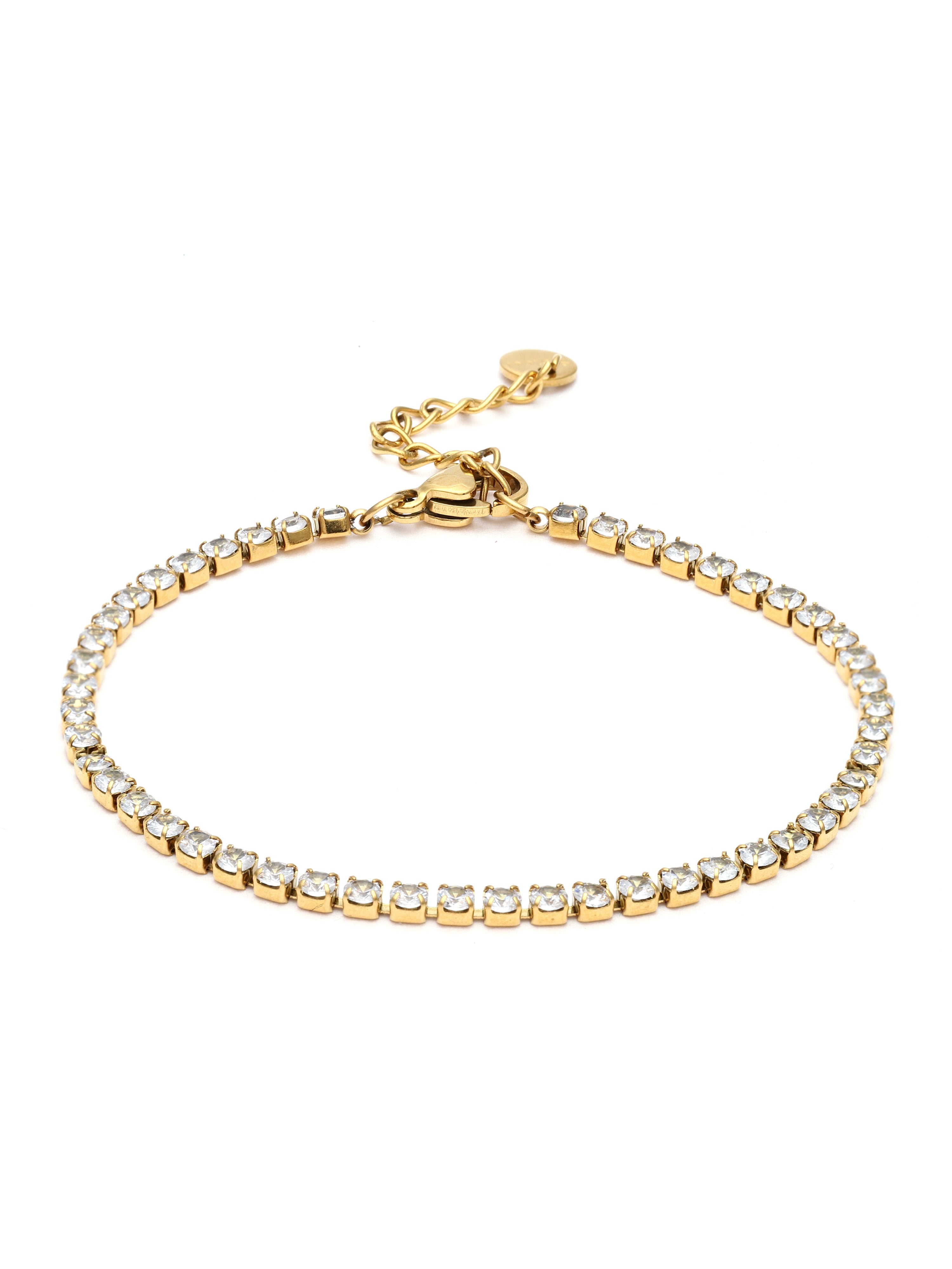 Gold bracelet with clear stones on a white background