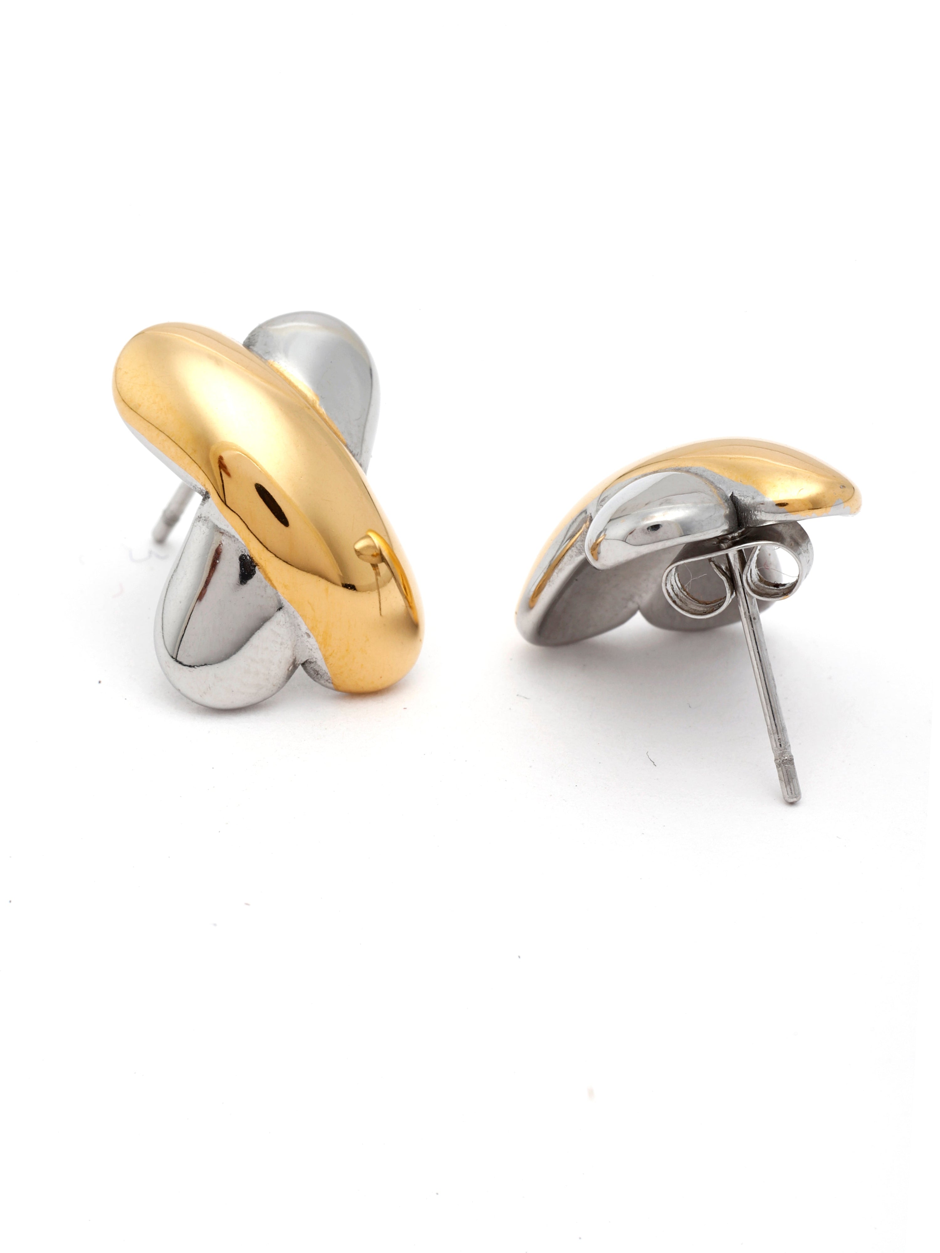 Pair of gold and silver earrings on a white background