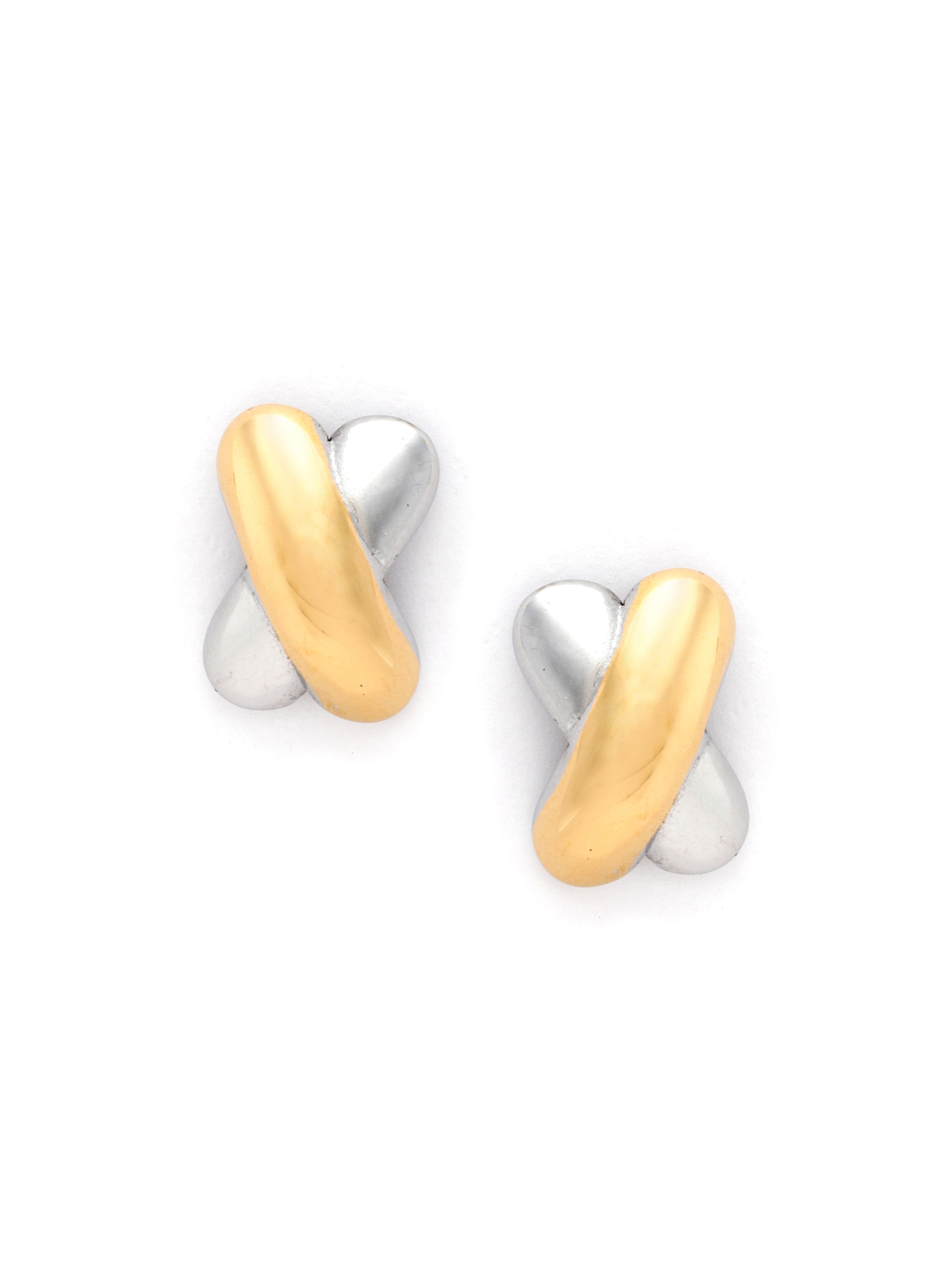 Pair of gold and silver earrings on a white background
