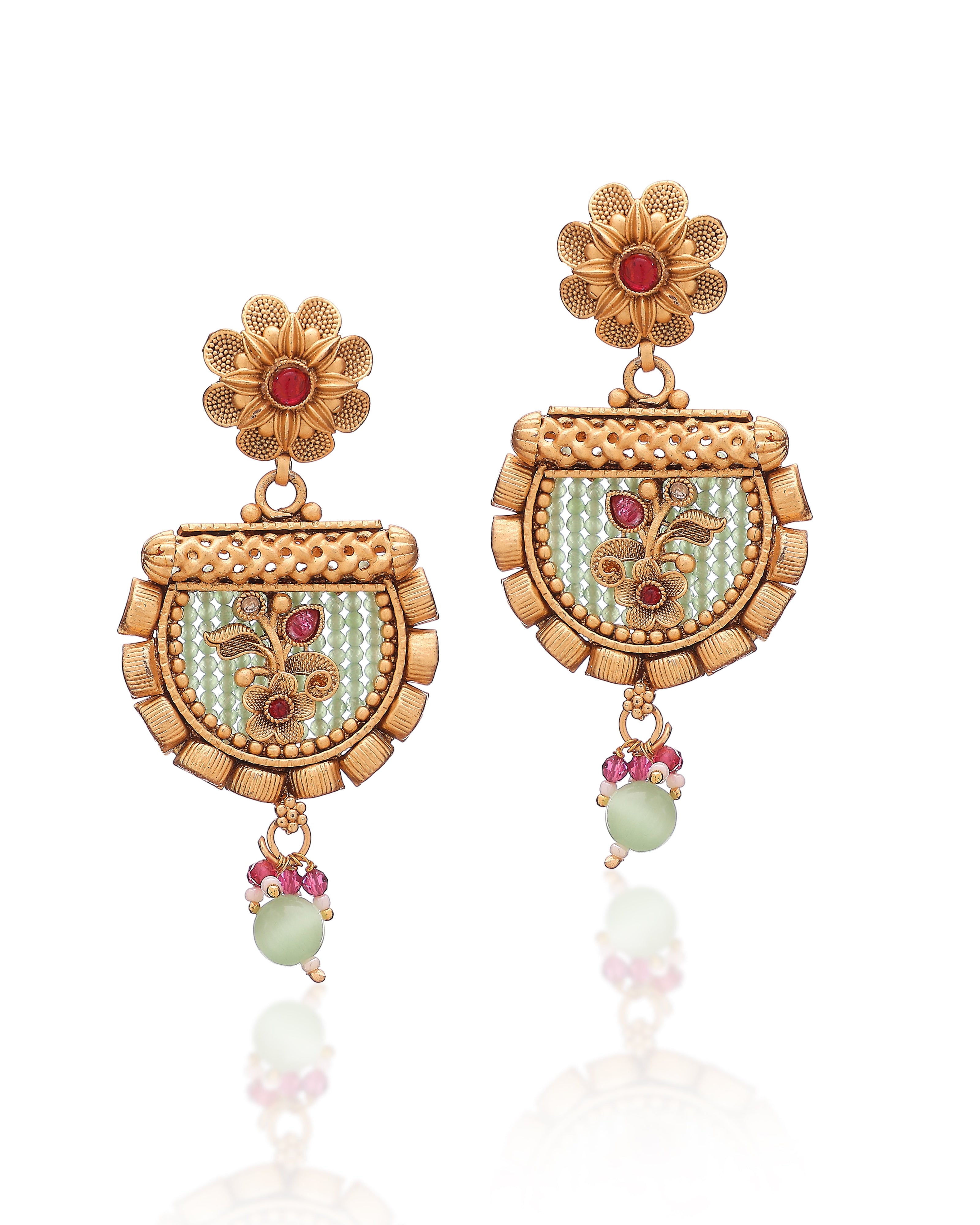 Ornate gold earrings with floral designs and gemstones on a white background