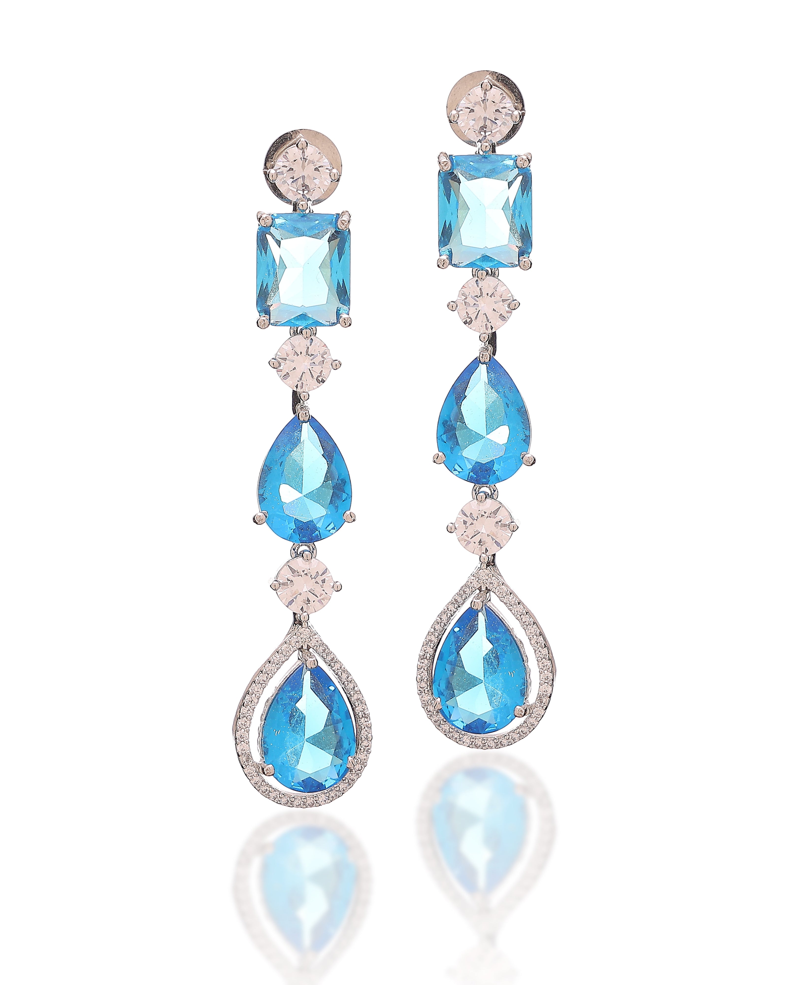 Pair of blue gemstone earrings with silver accents on a white background
