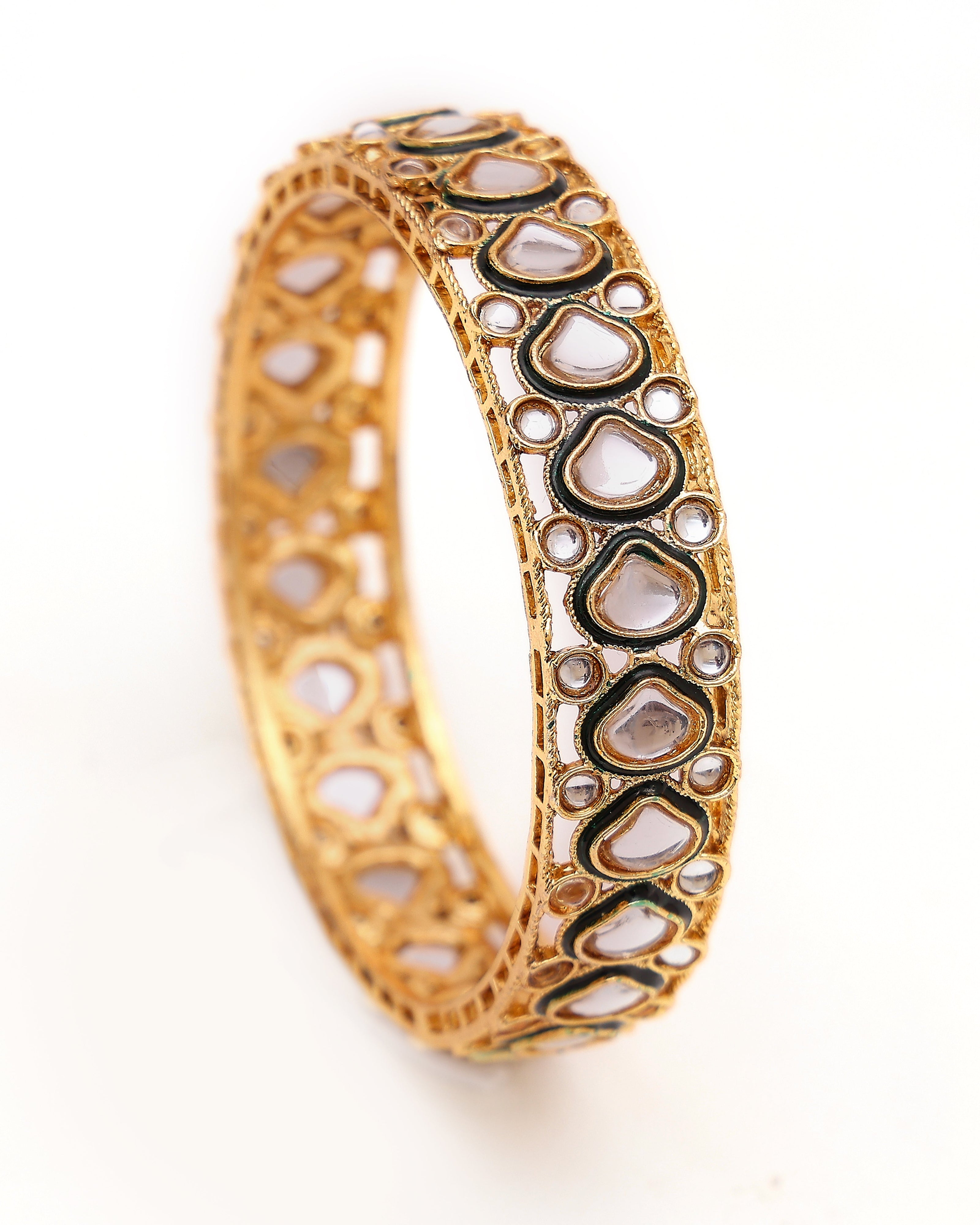 Gold bracelet with heart-shaped design on a white background