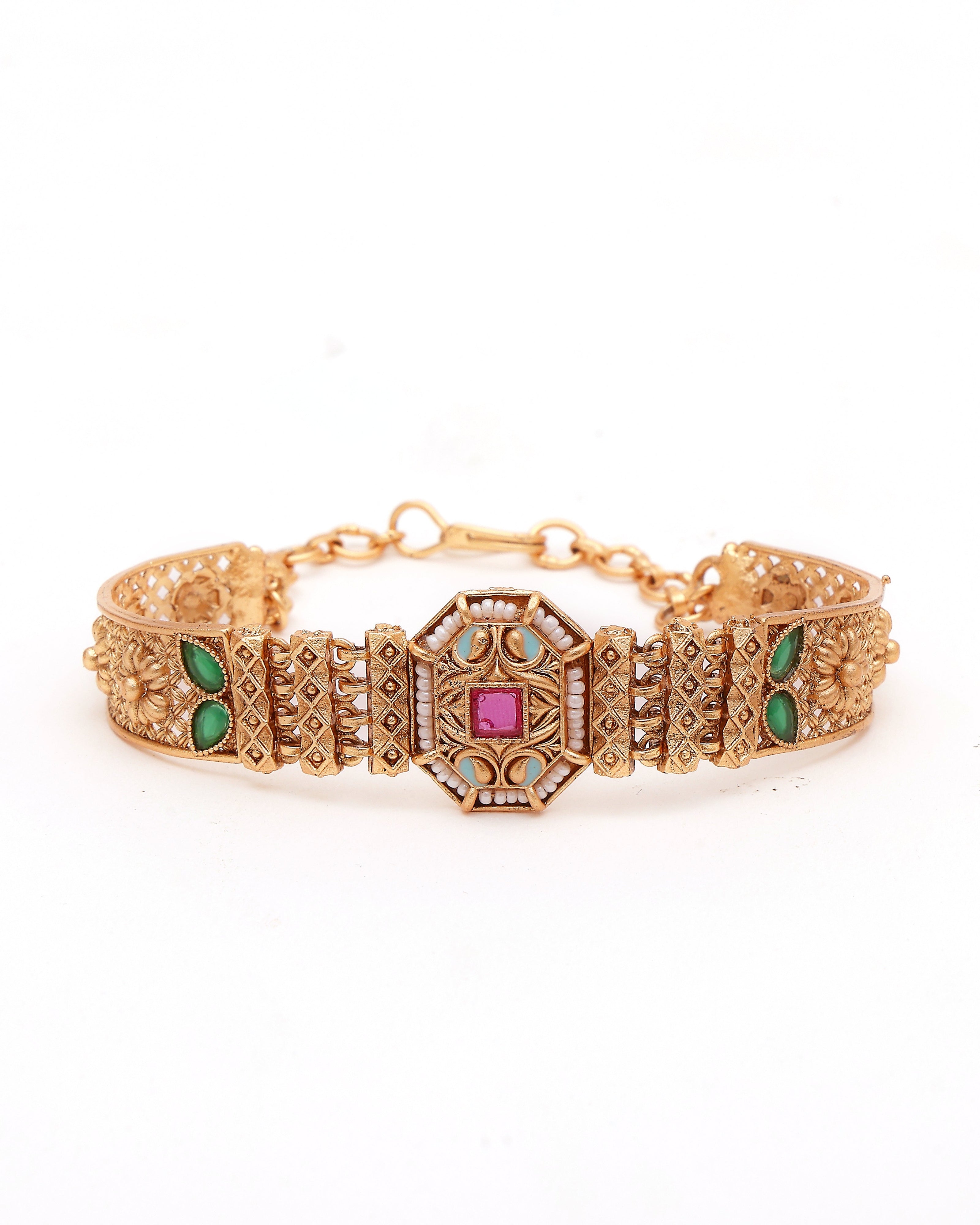 Gold bracelet with gemstones on a white background