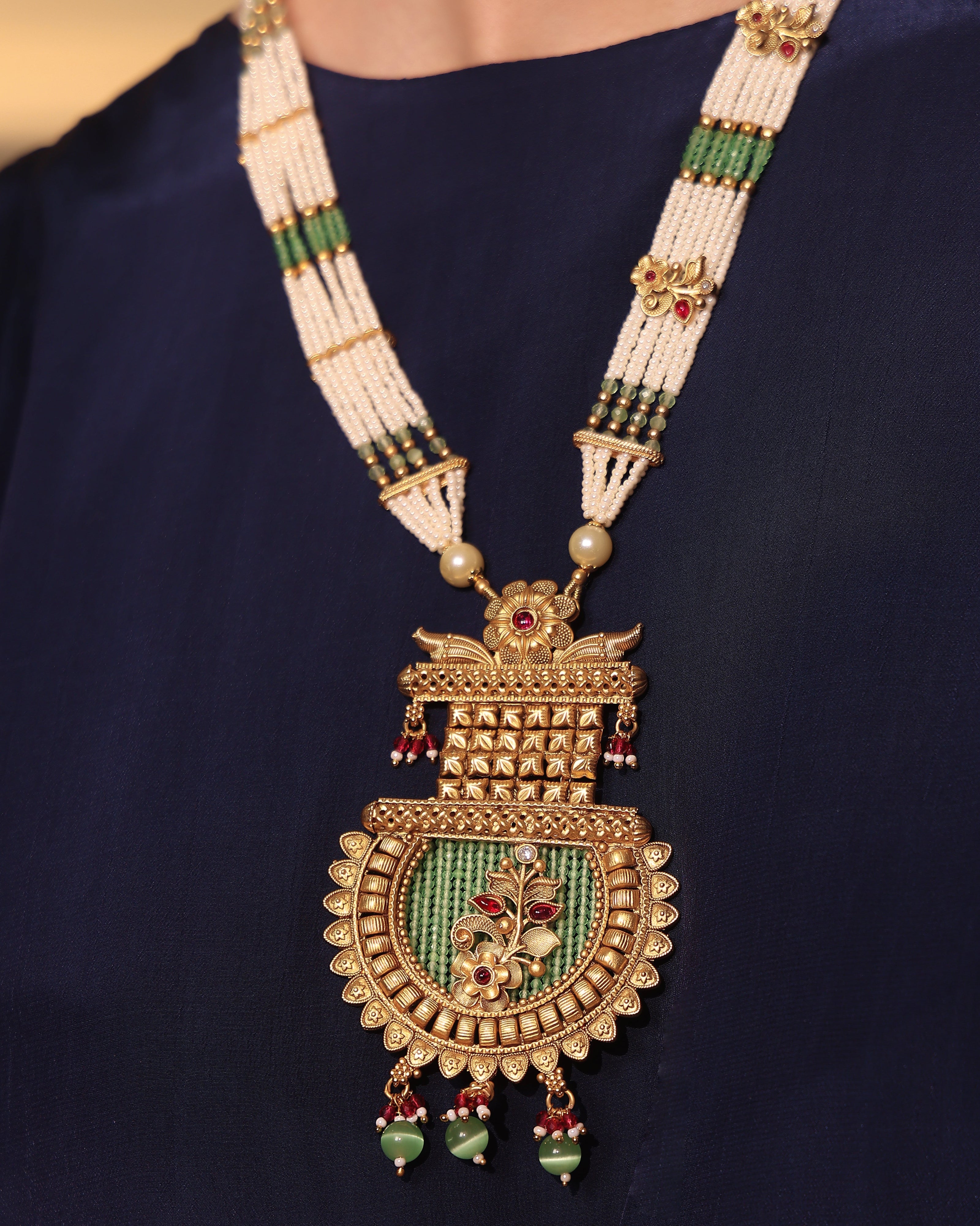 Decorative necklace with a large pendant on a dark background