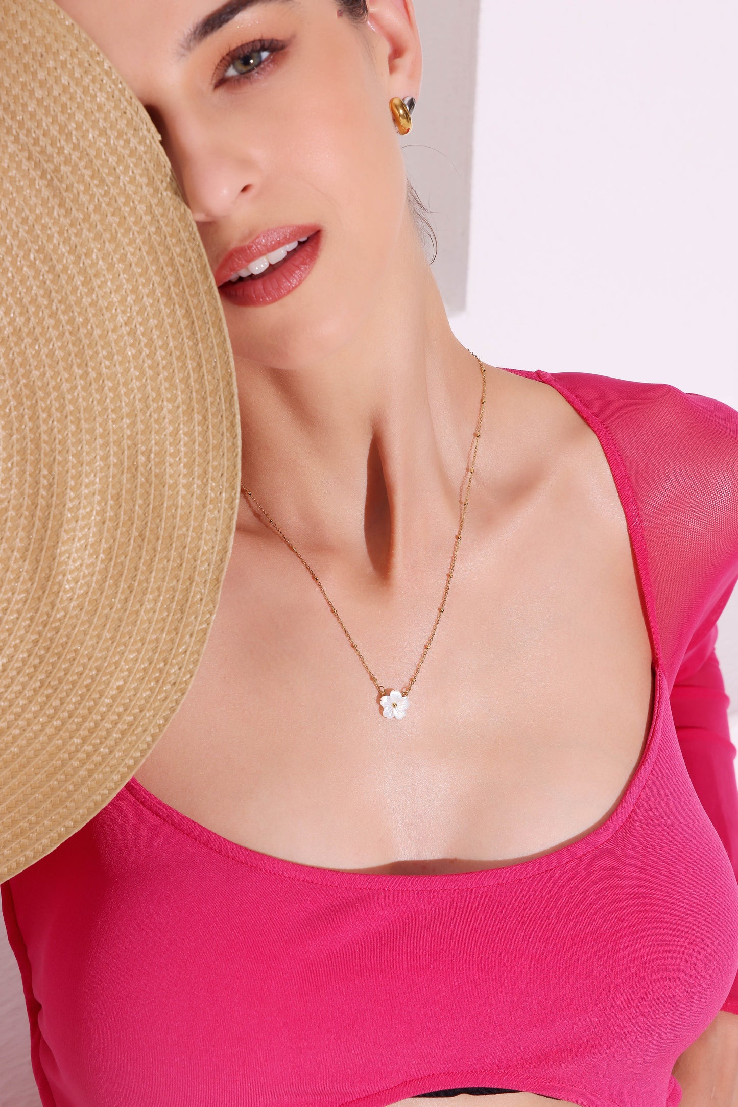Model wearing Floral Charm Necklace – side profile