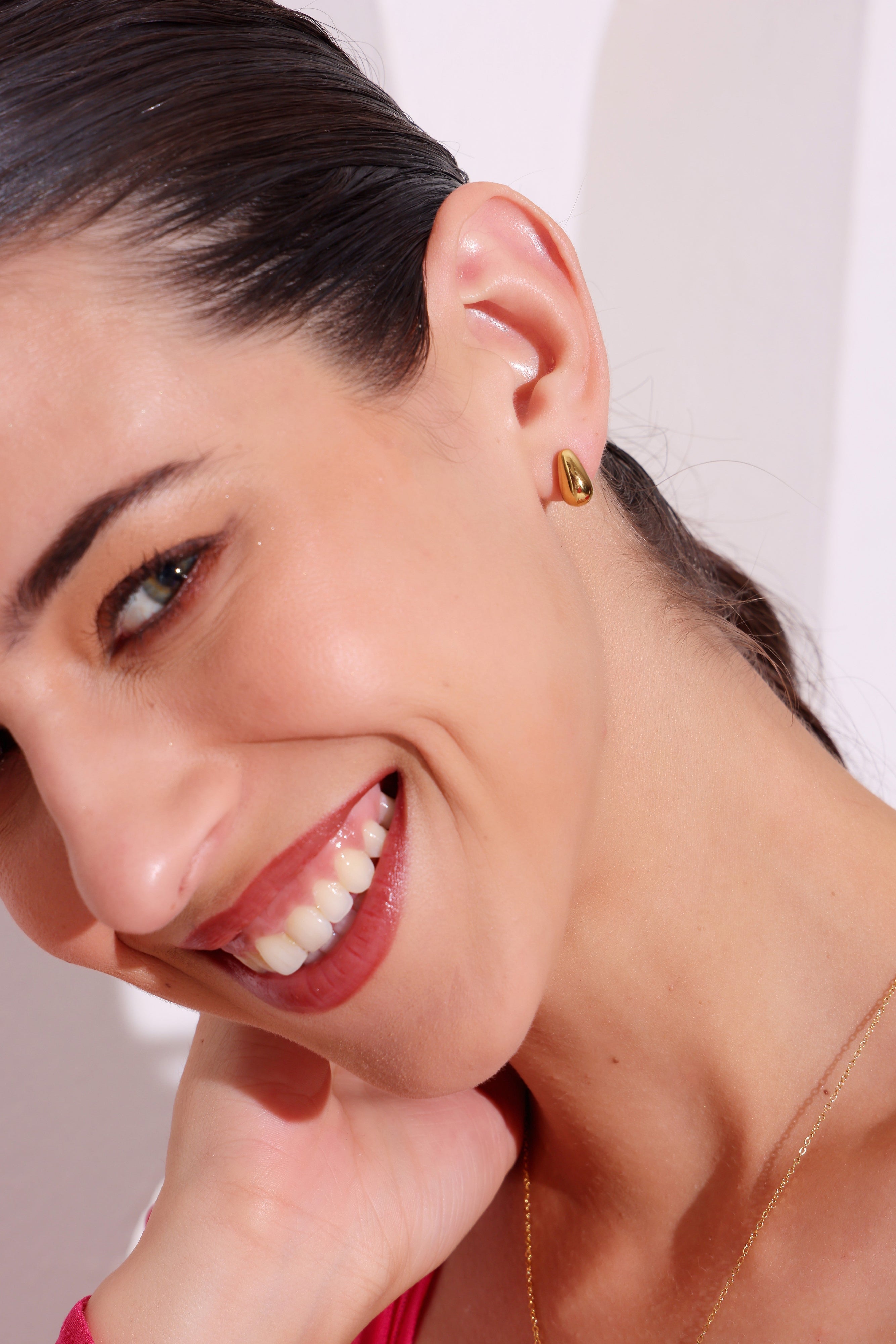 Model wearing Gleam Drop Studs – front view