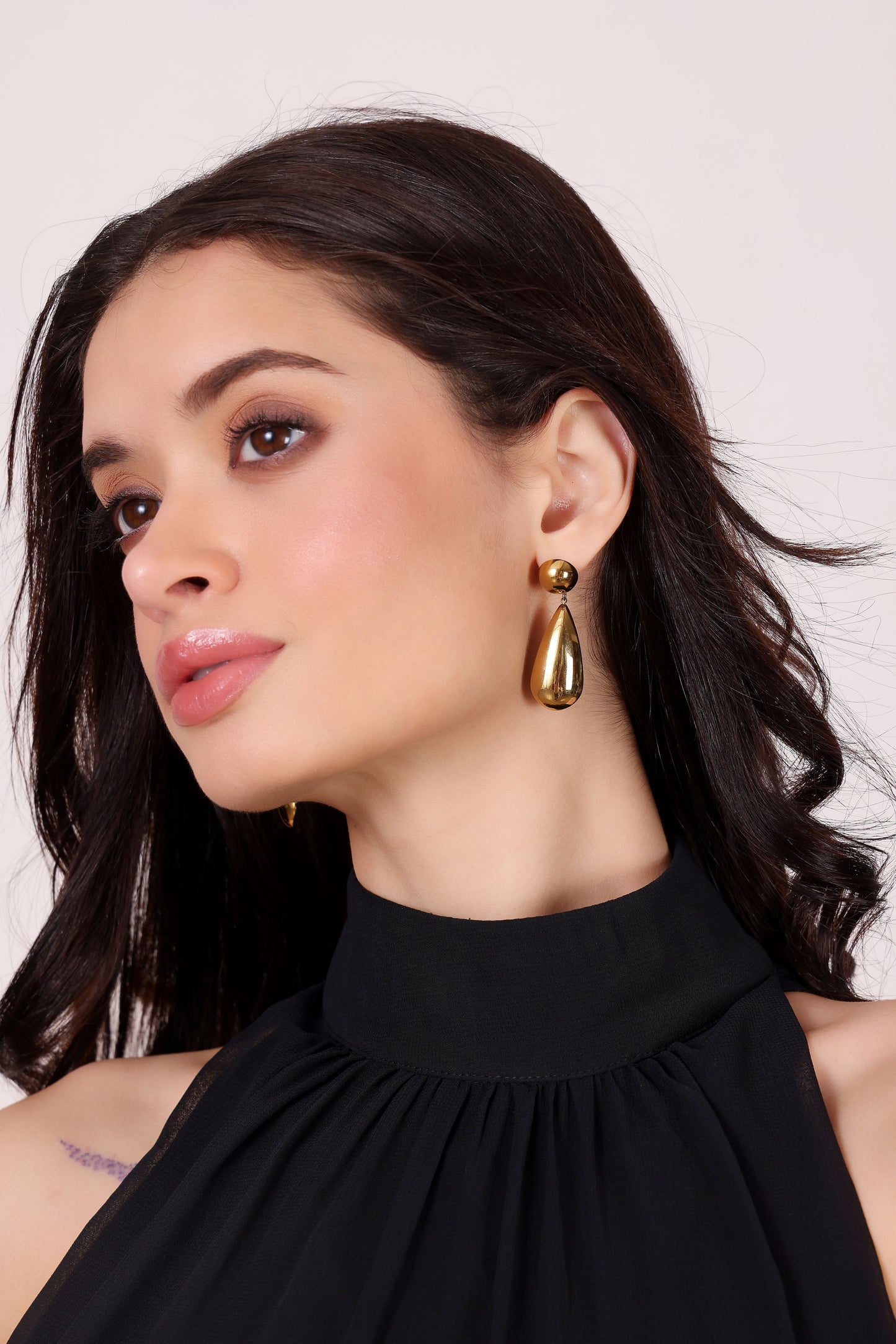Model wearing Solace Drops – side profile