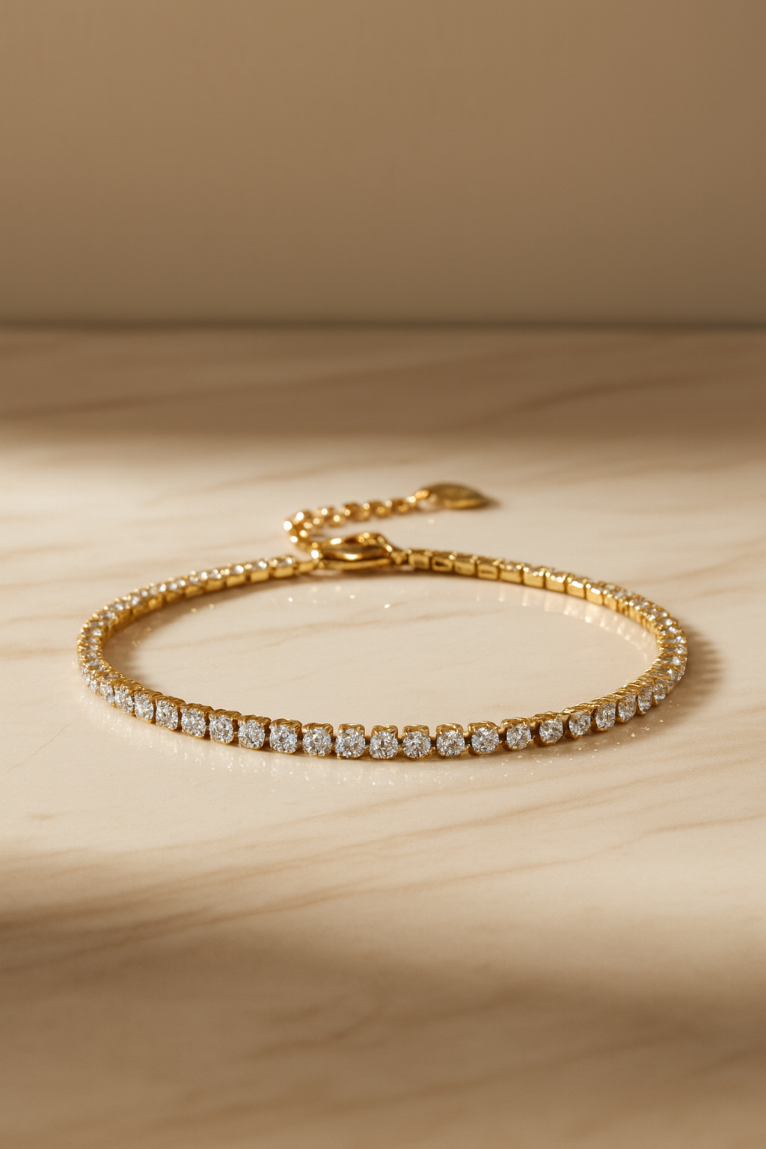 Gold bracelet with diamonds on a wooden surface