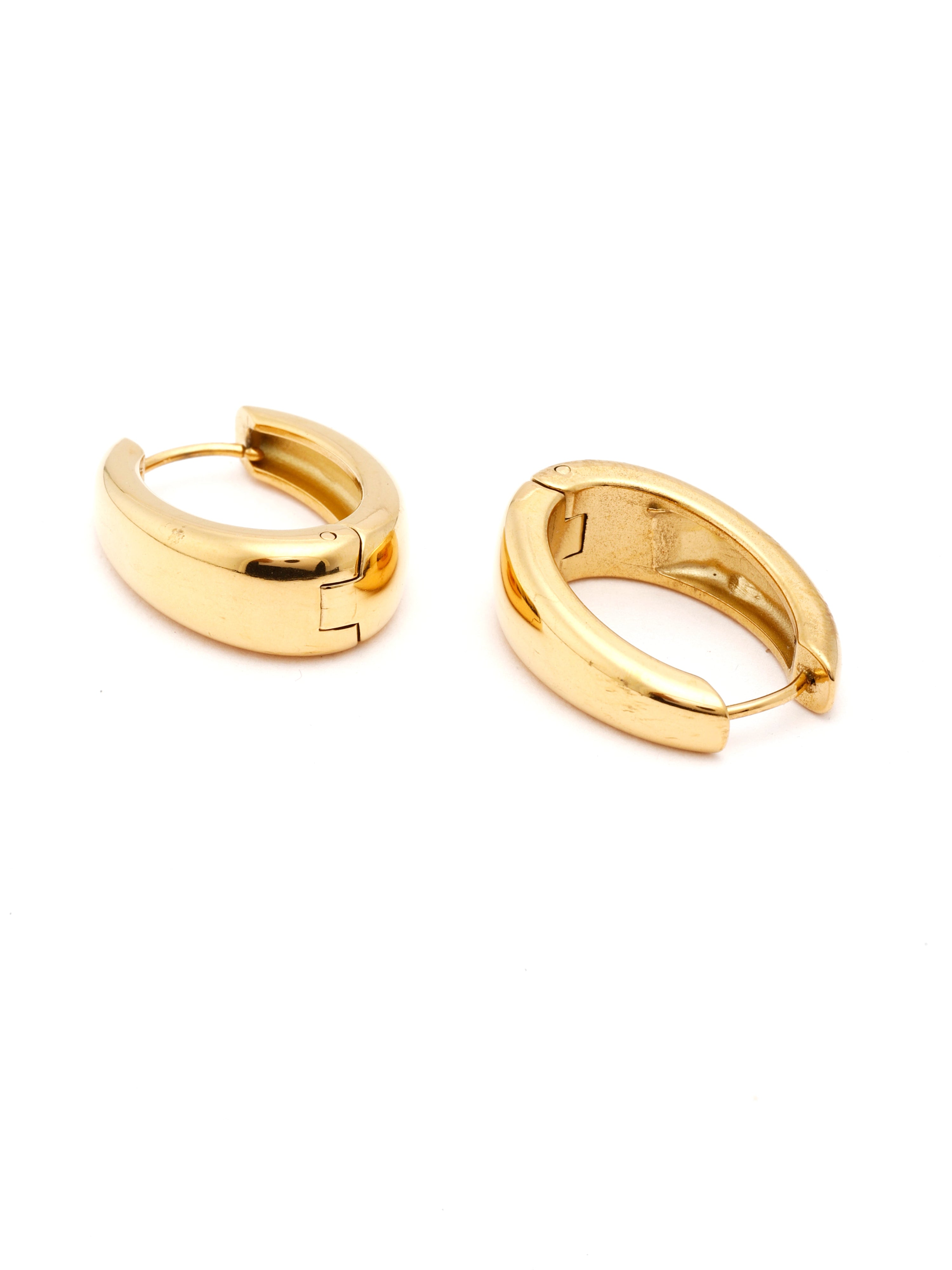Pair of gold hoop earrings on a white background