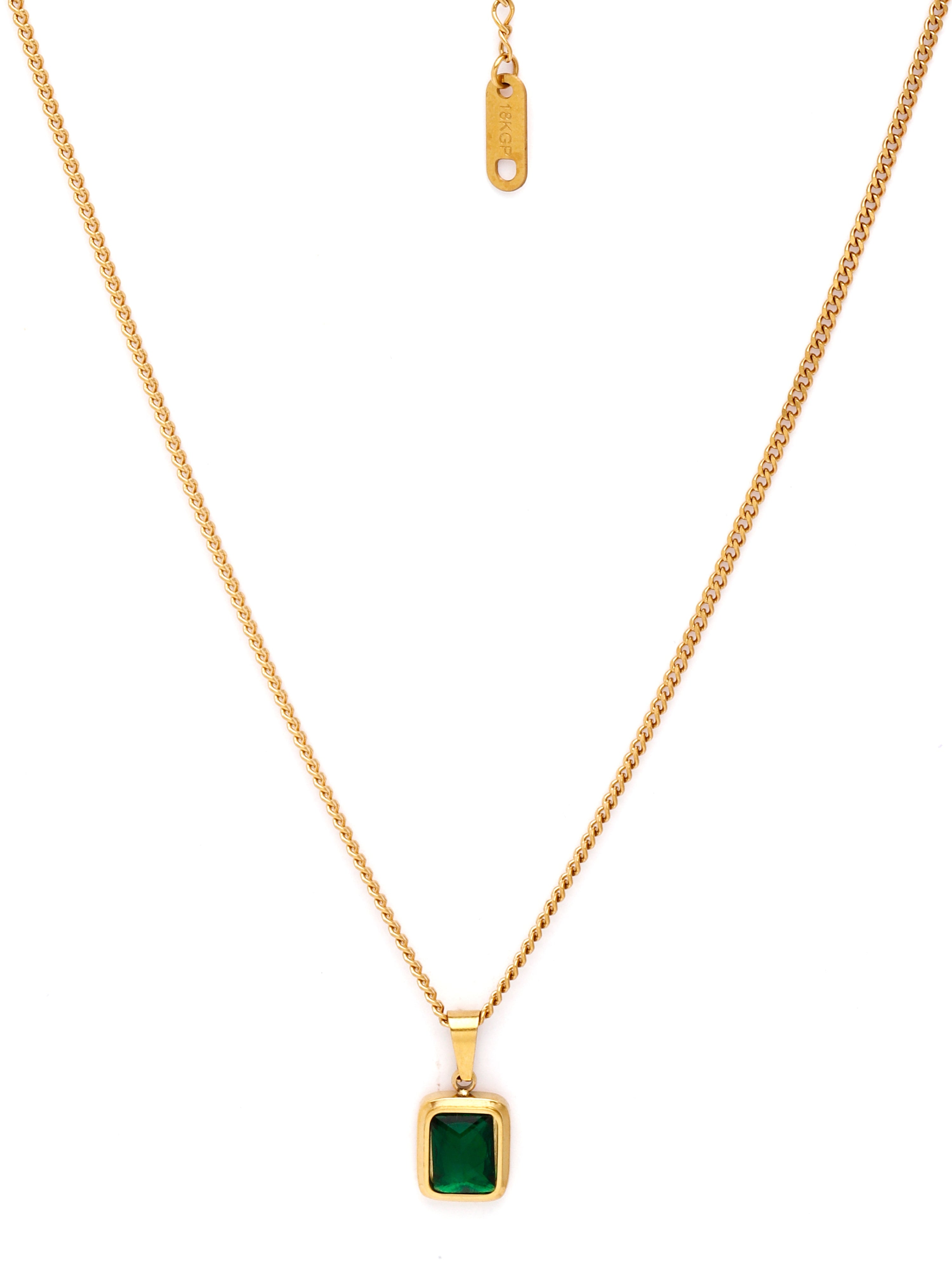 Gold necklace with a green pendant on a white background
