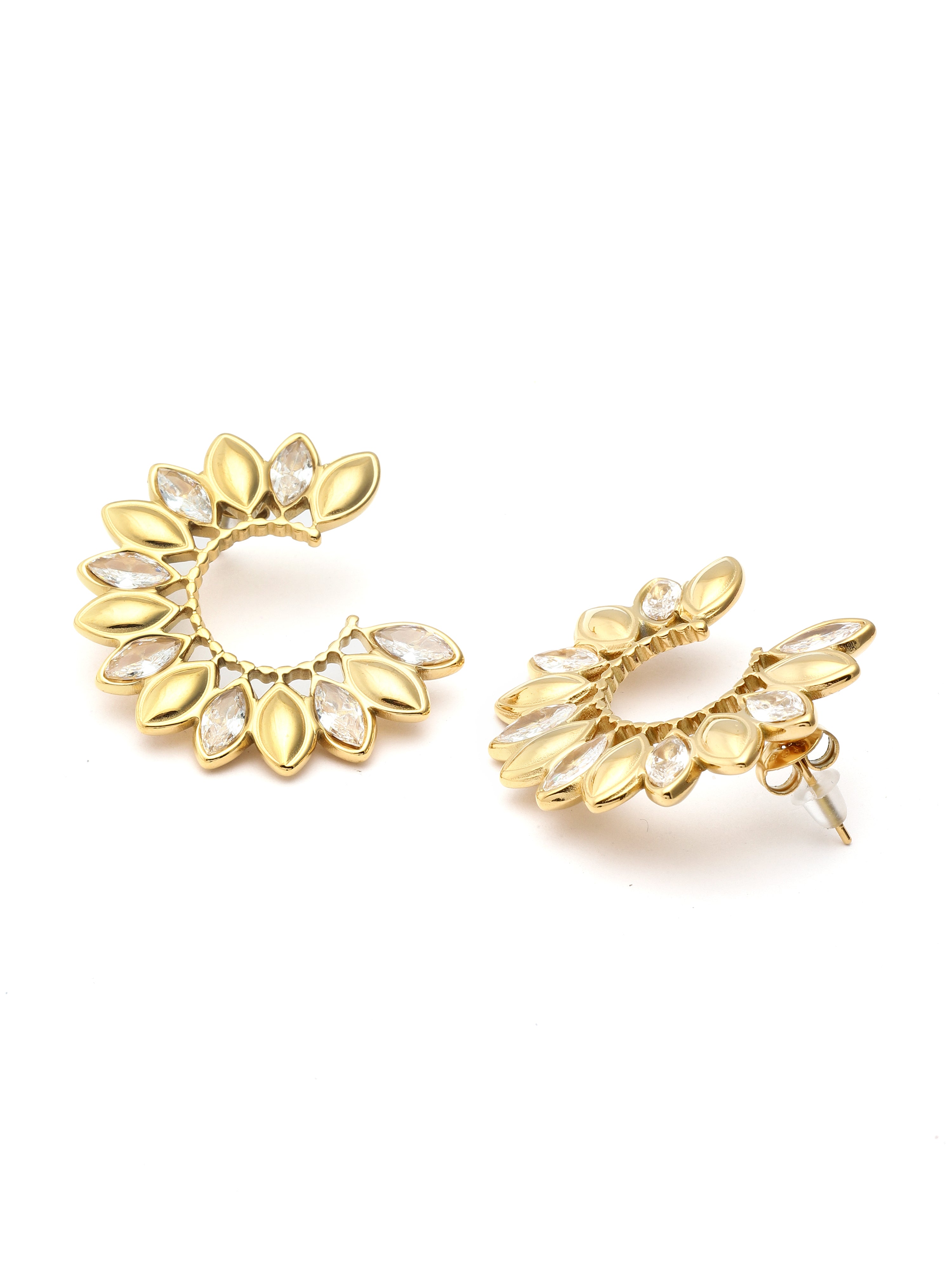 Pair of gold floral earrings with clear stones on a white background