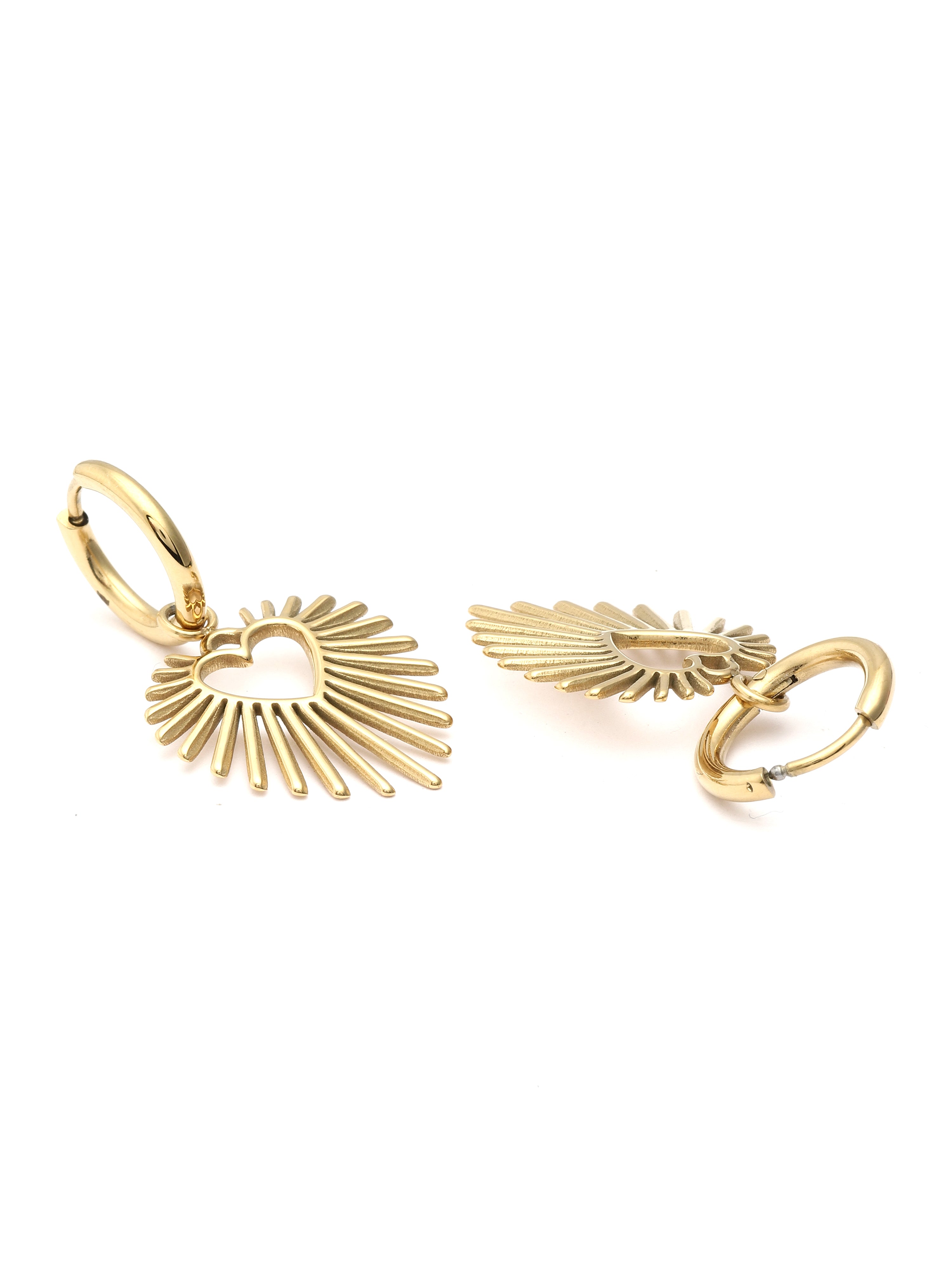 Gold sunburst earring and ring set on a white background