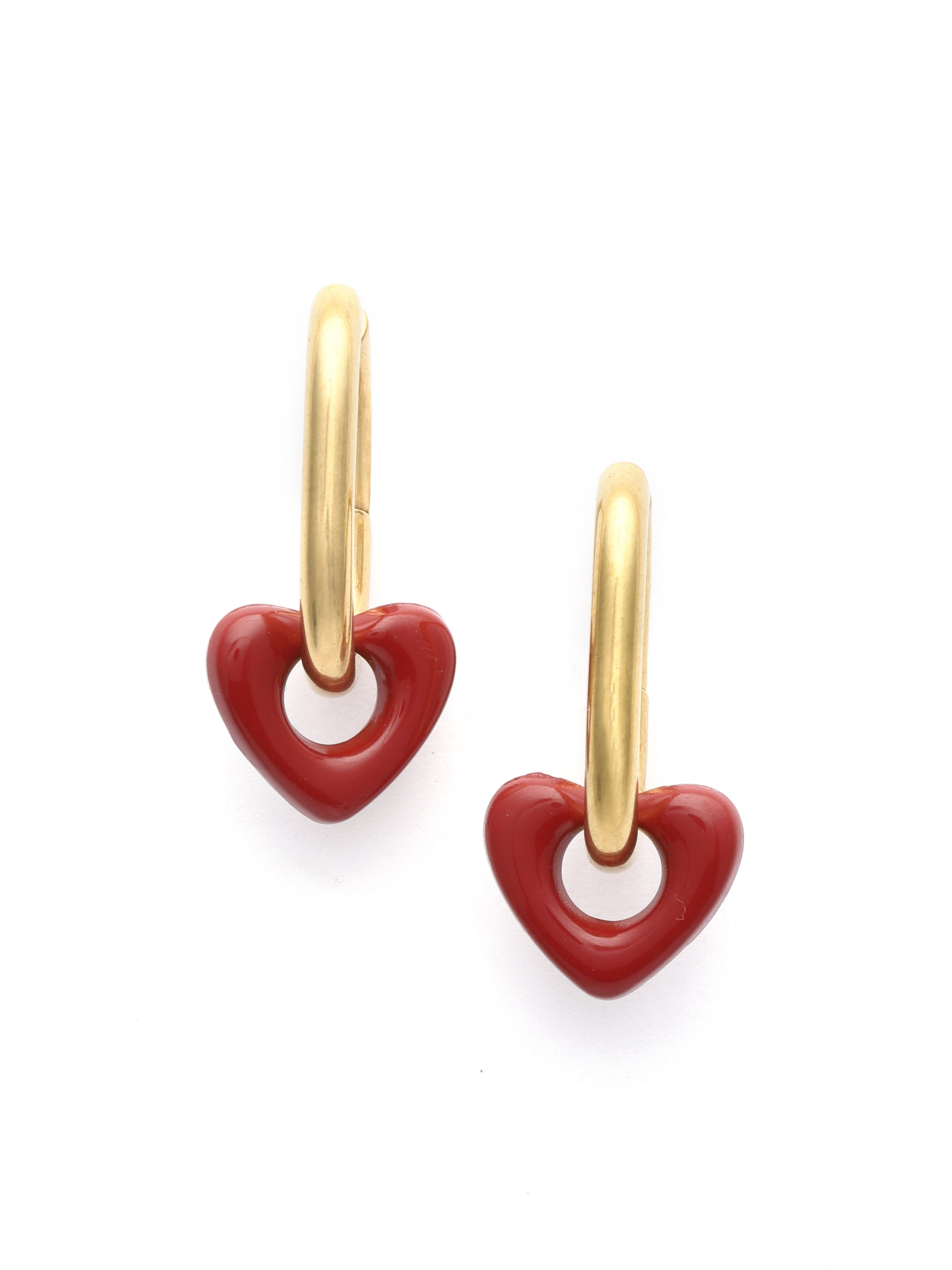 Gold hoop earrings with red heart charms on a white background