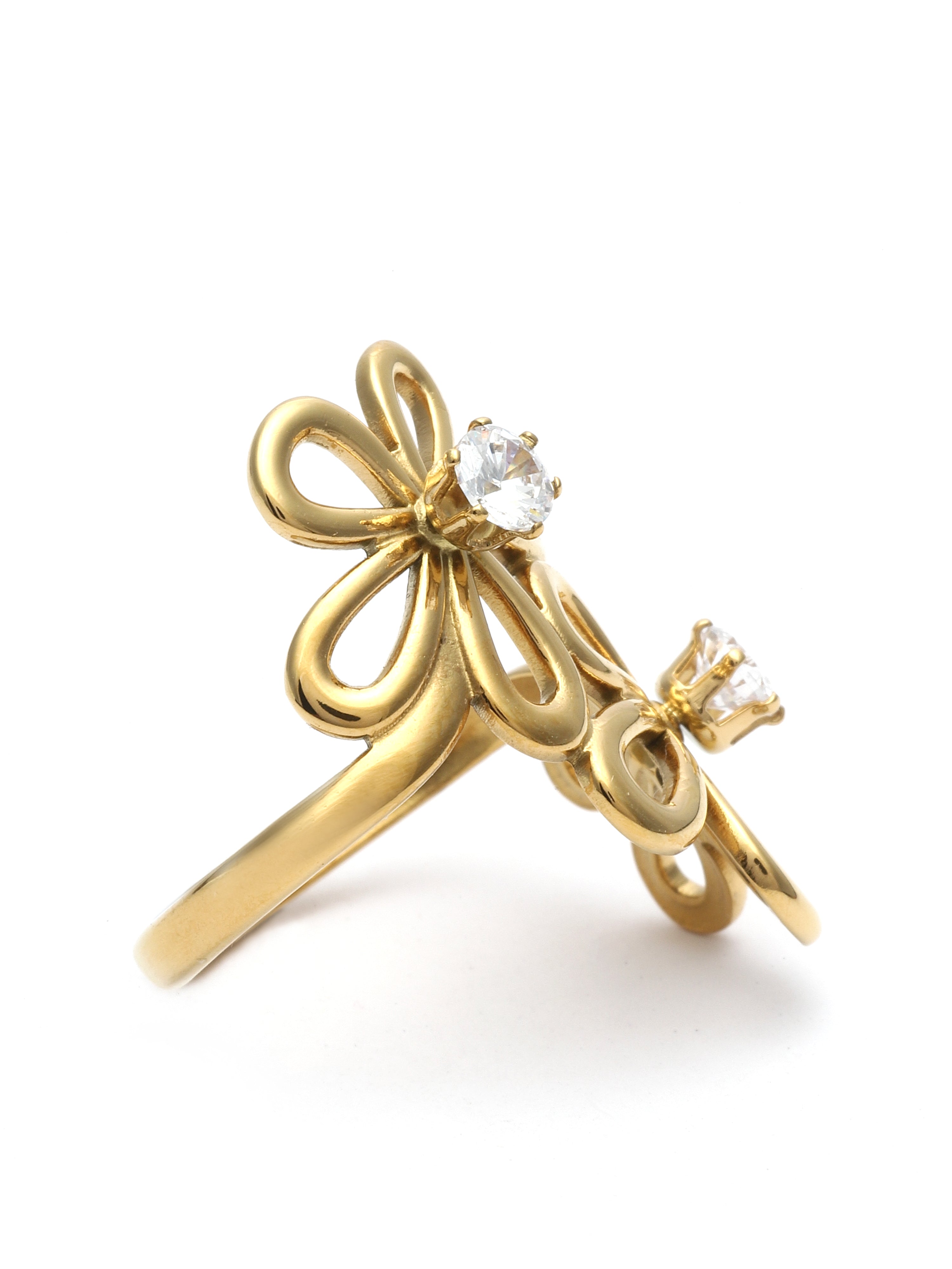 Gold ring with bow and heart design on a white background