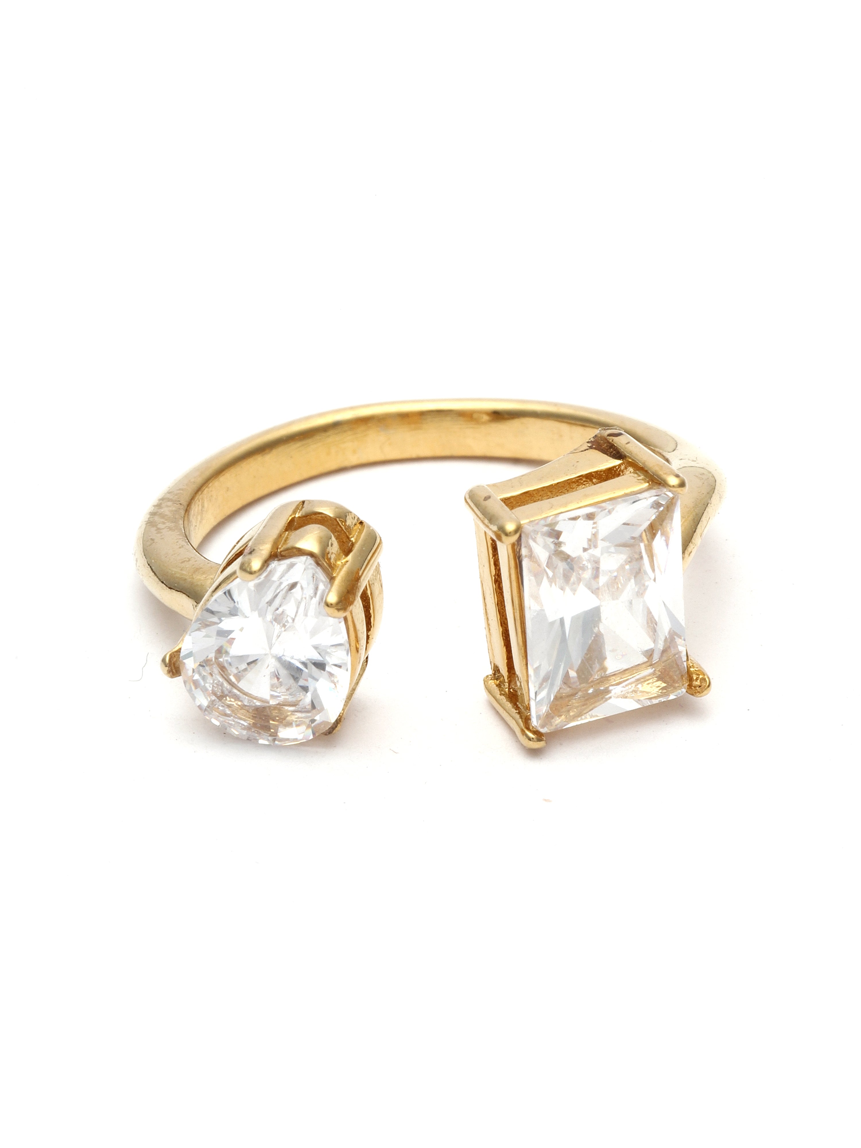 Gold ring with two clear gemstones on a white background