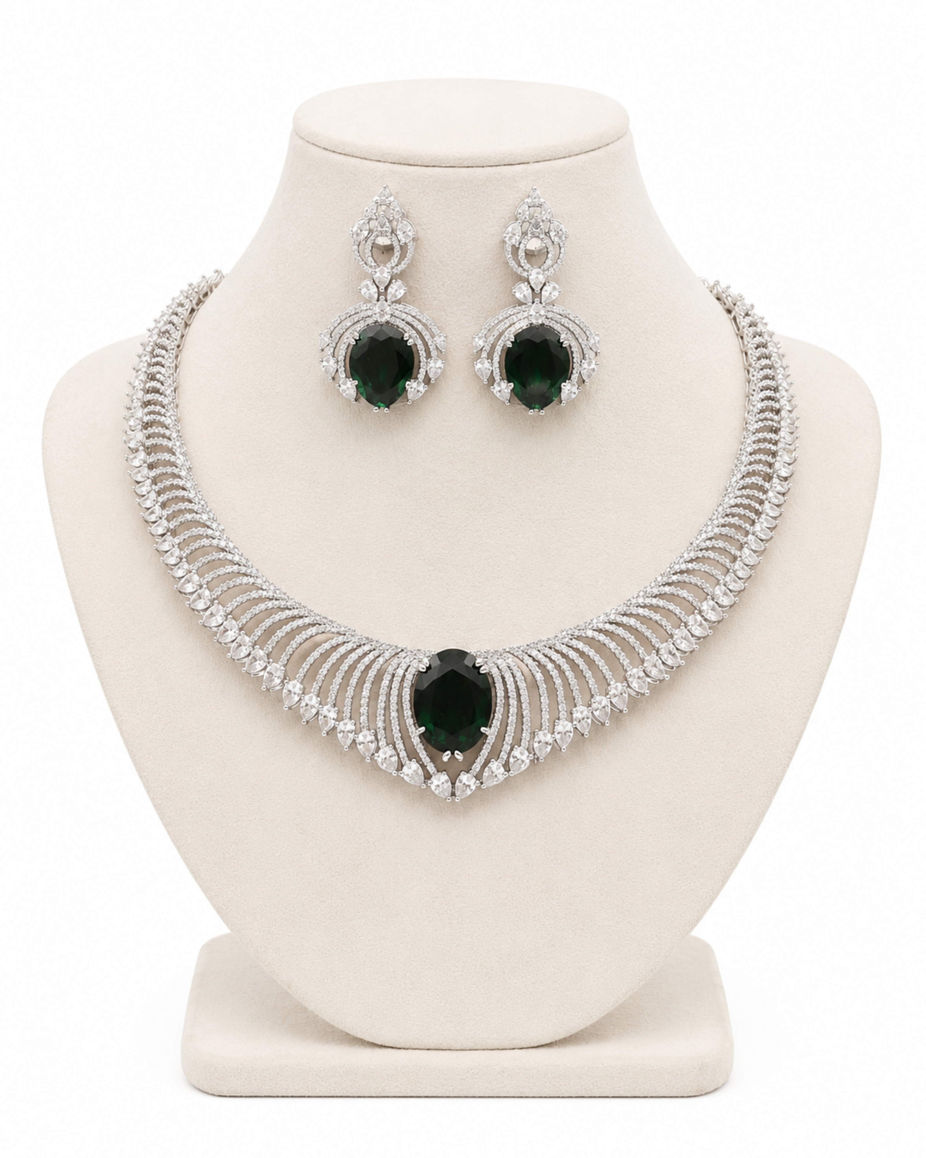 Jewelry set with necklace and earrings on a white stand