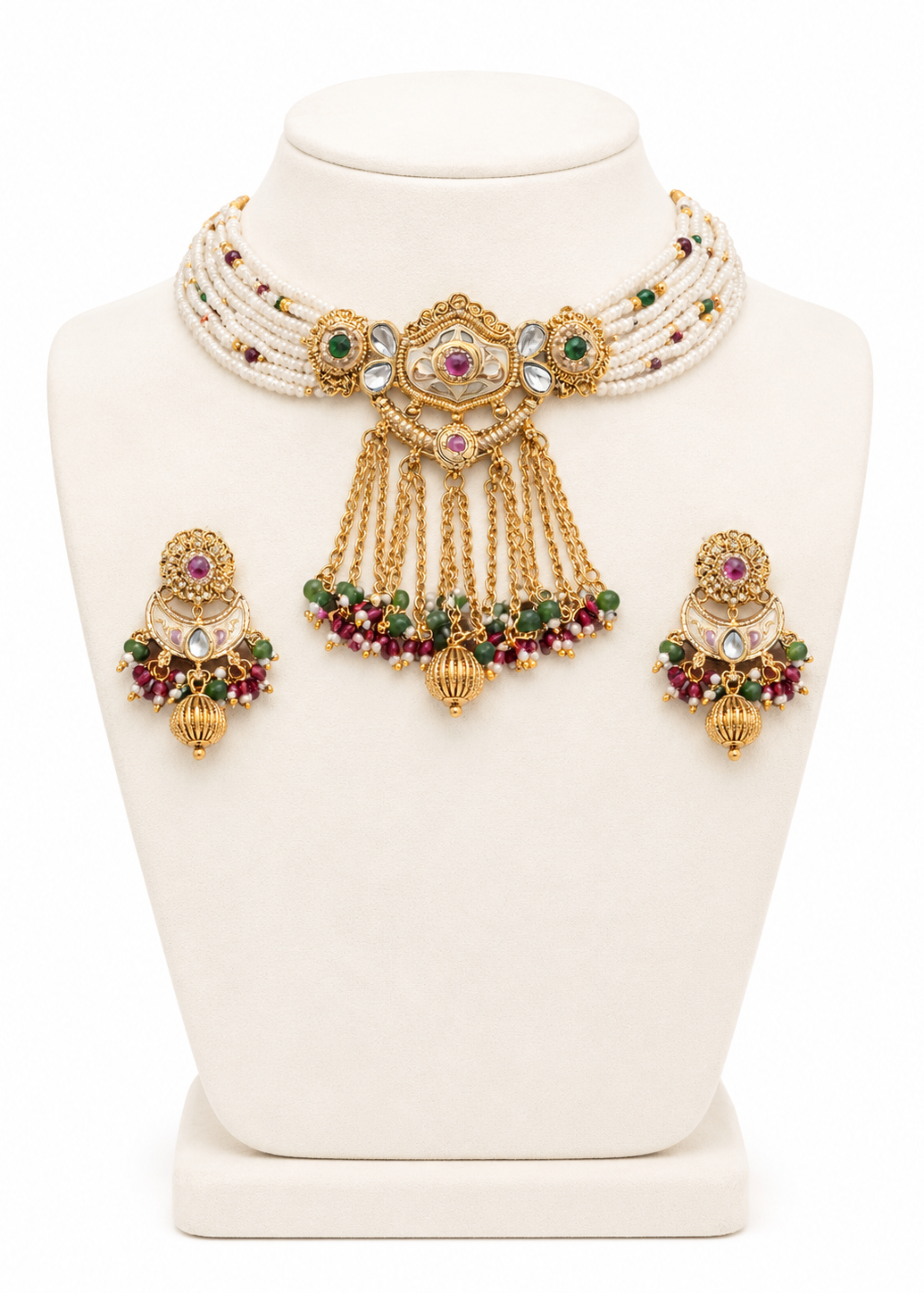 Ornate necklace and earrings set on a white mannequin bust