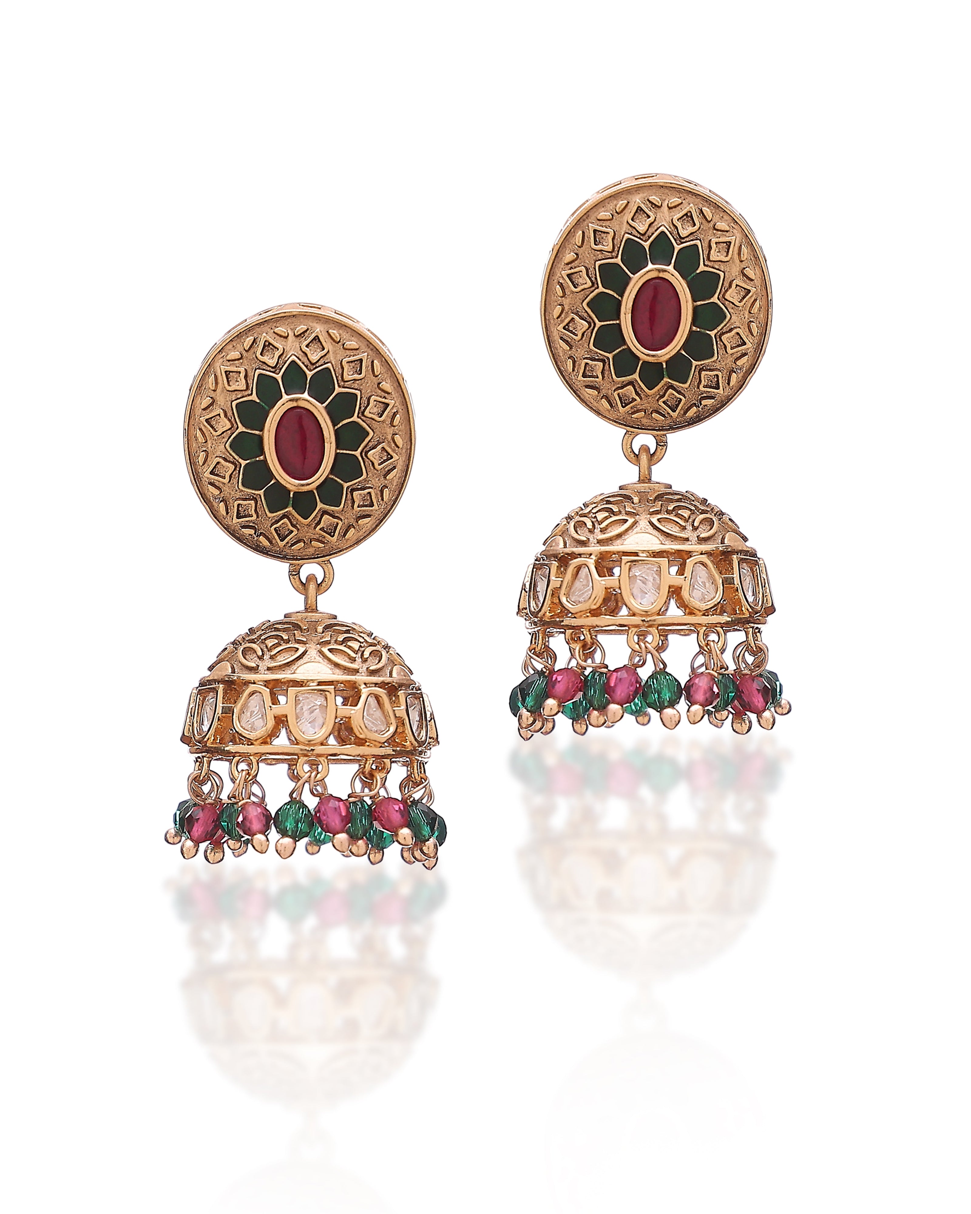 Ornate gold earrings with gemstones on a white background