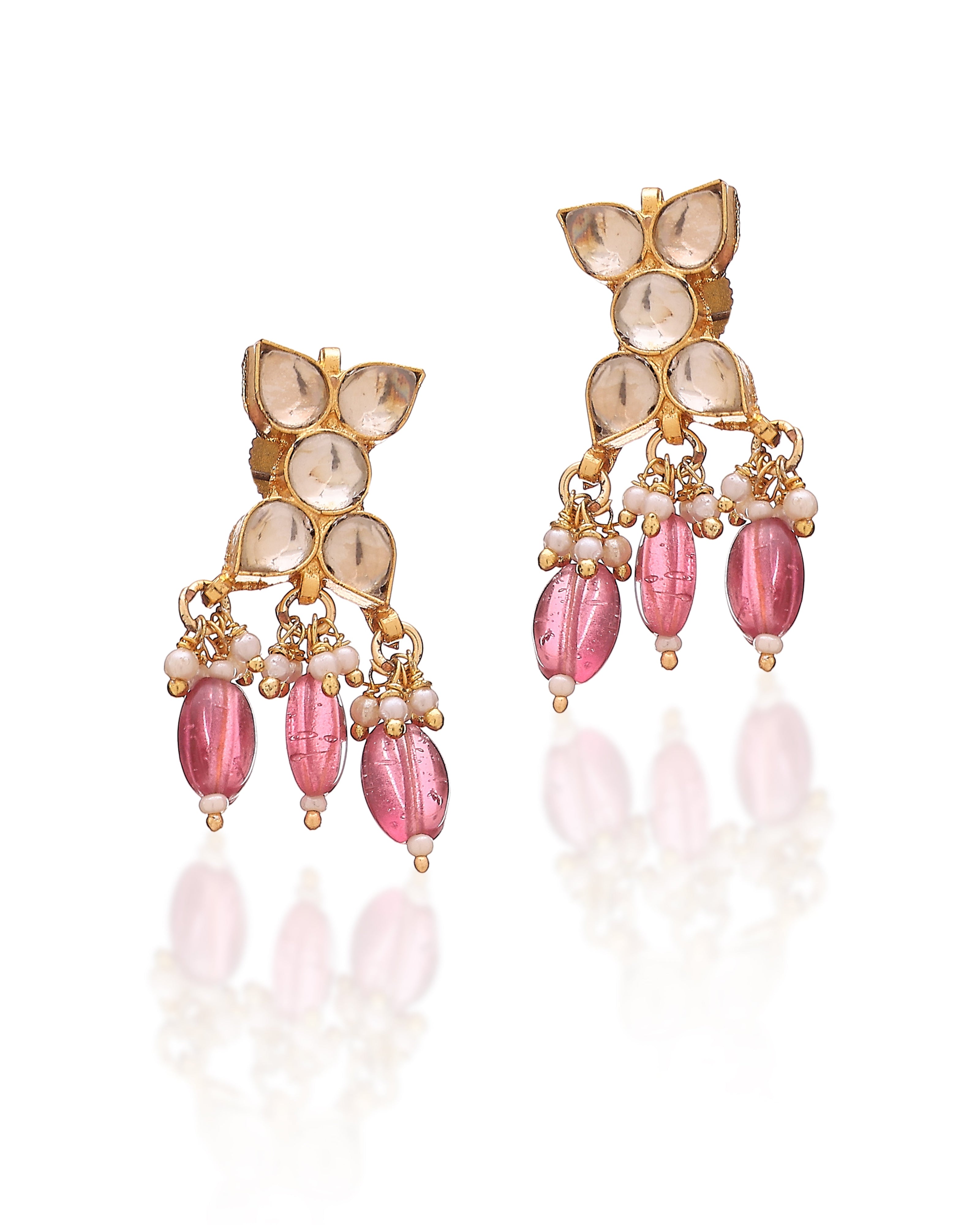 Ornate earrings with pink beads and gold accents on a white background