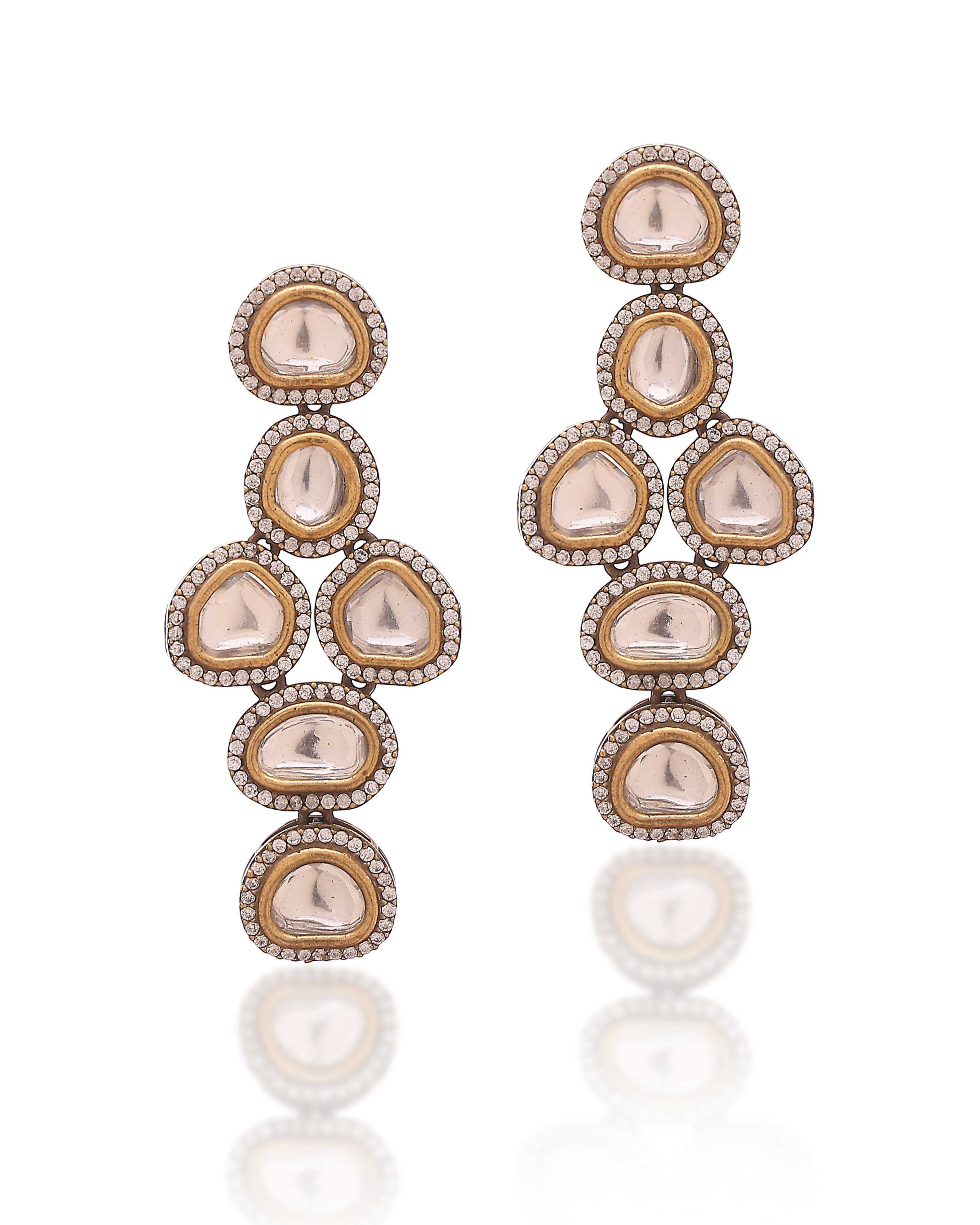Ornate earrings with multiple gemstones on a white background
