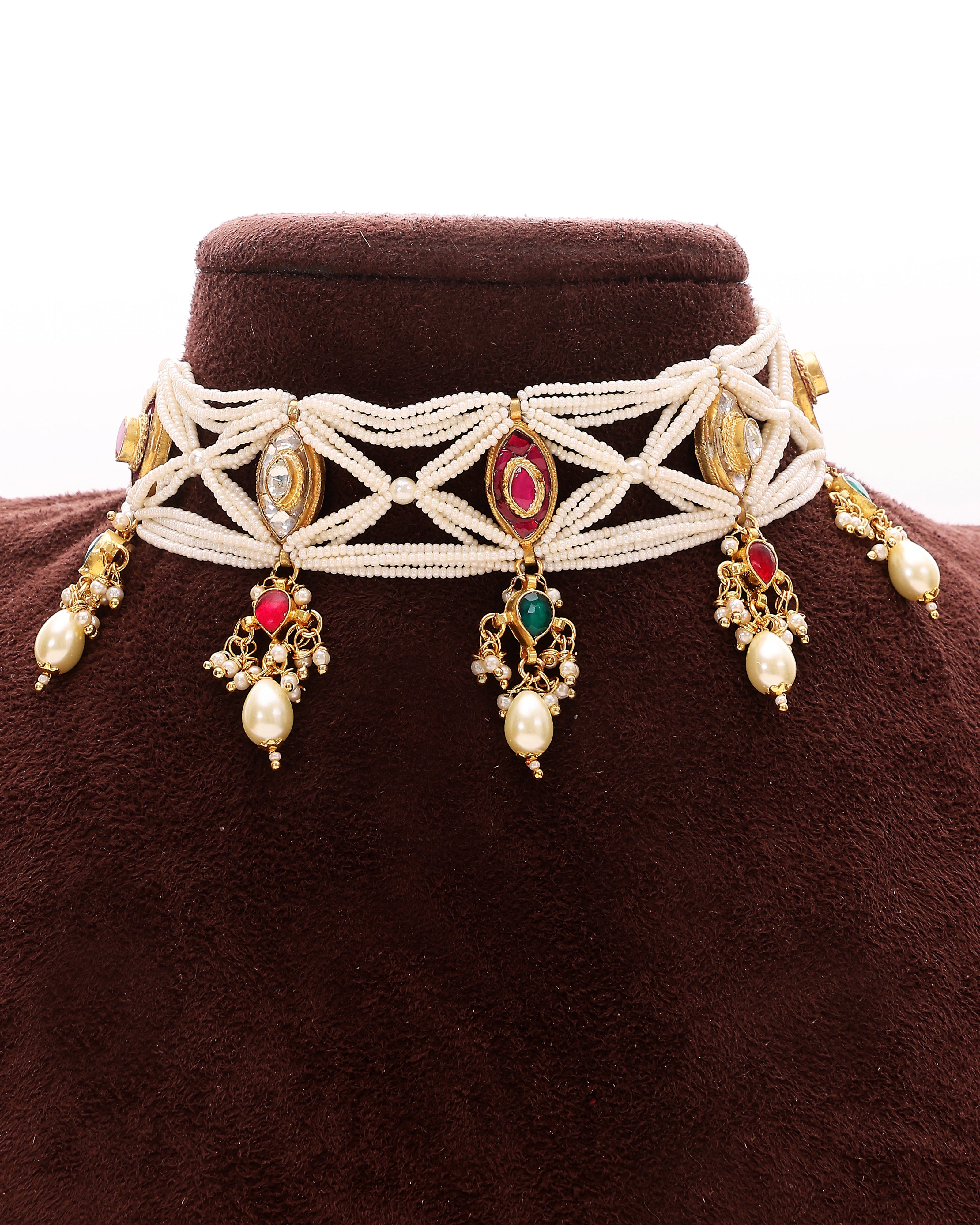 Decorative necklace with beads and stones on a brown velvet stand