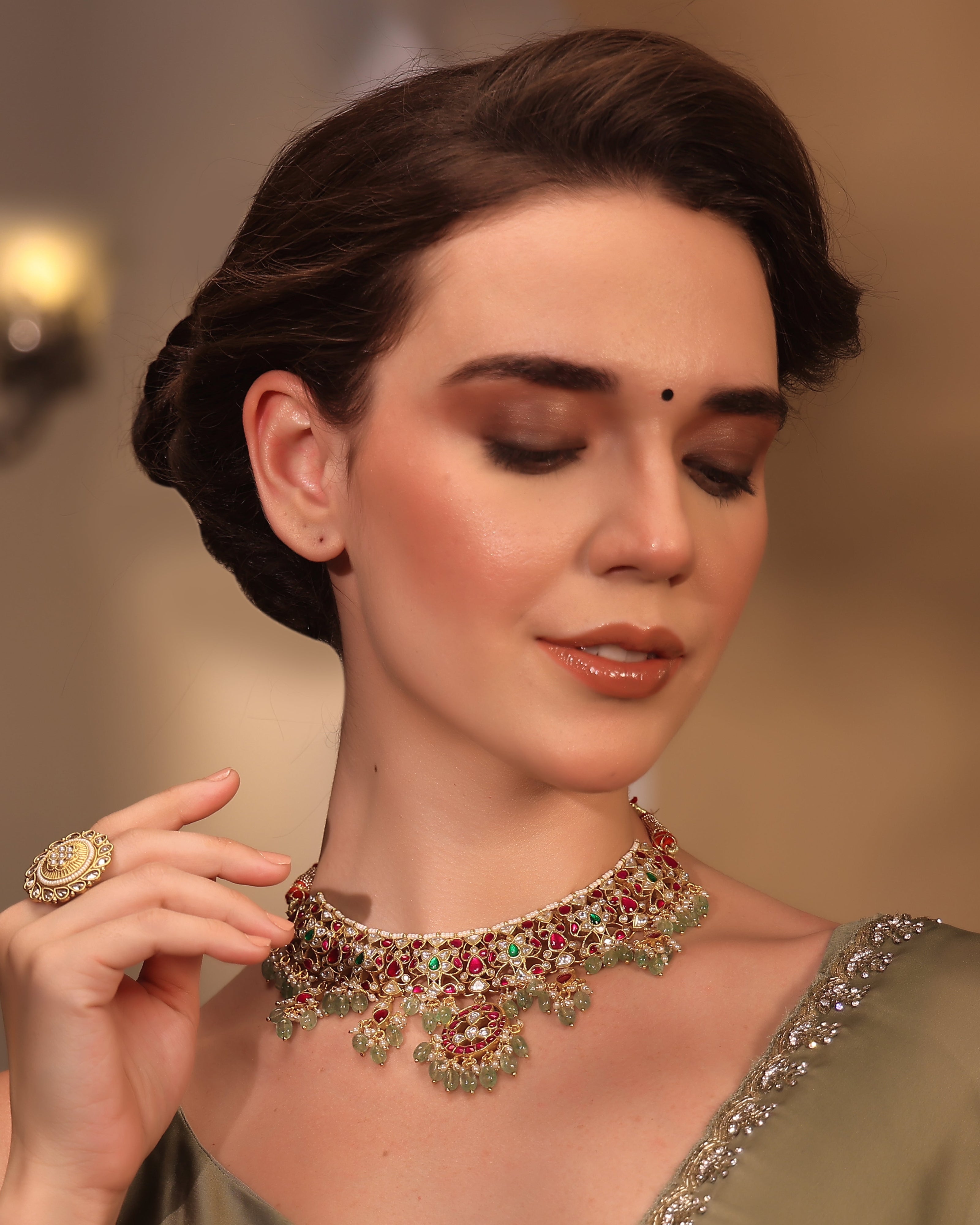 Woman wearing a decorative necklace with a blurred background
