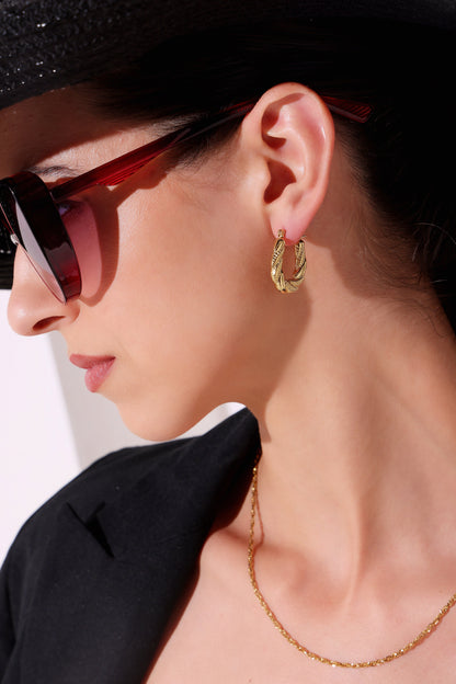 Model wearing Braided Glow Hoops – front view