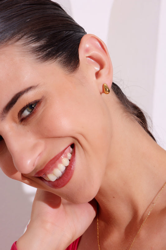 Model wearing Gleam Drop Studs – front view